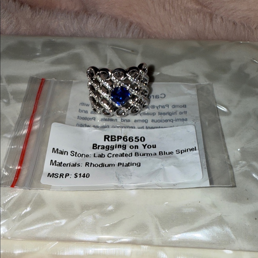 BP Silver Ring with Blue Gem